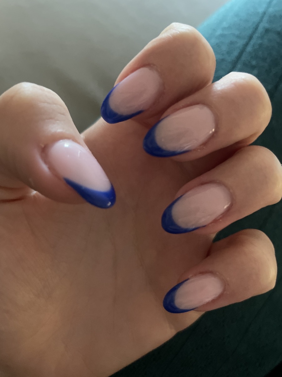 Almond nails with a bright cobalt-blue French tip