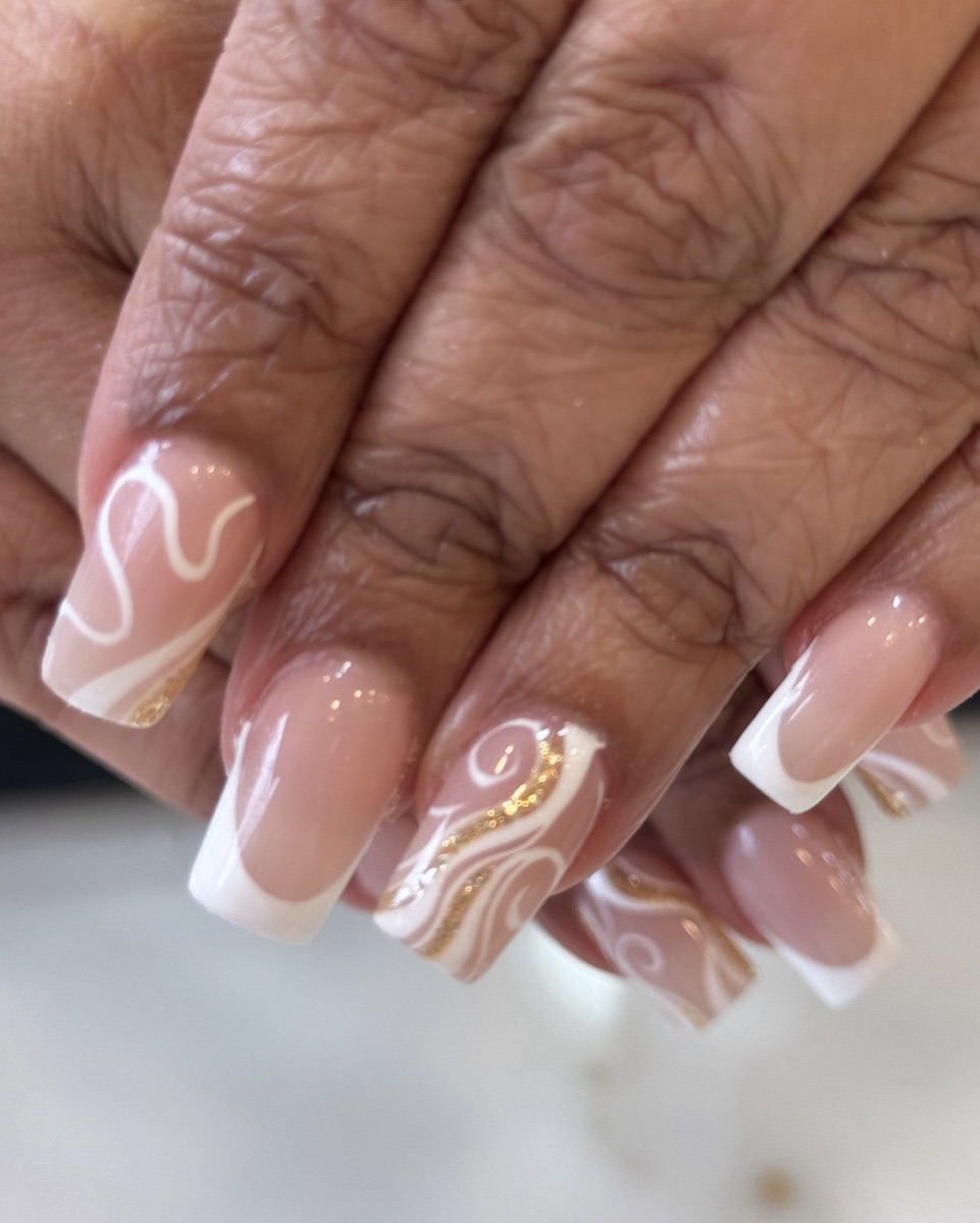 French nails with white and gold-glitter swirl art